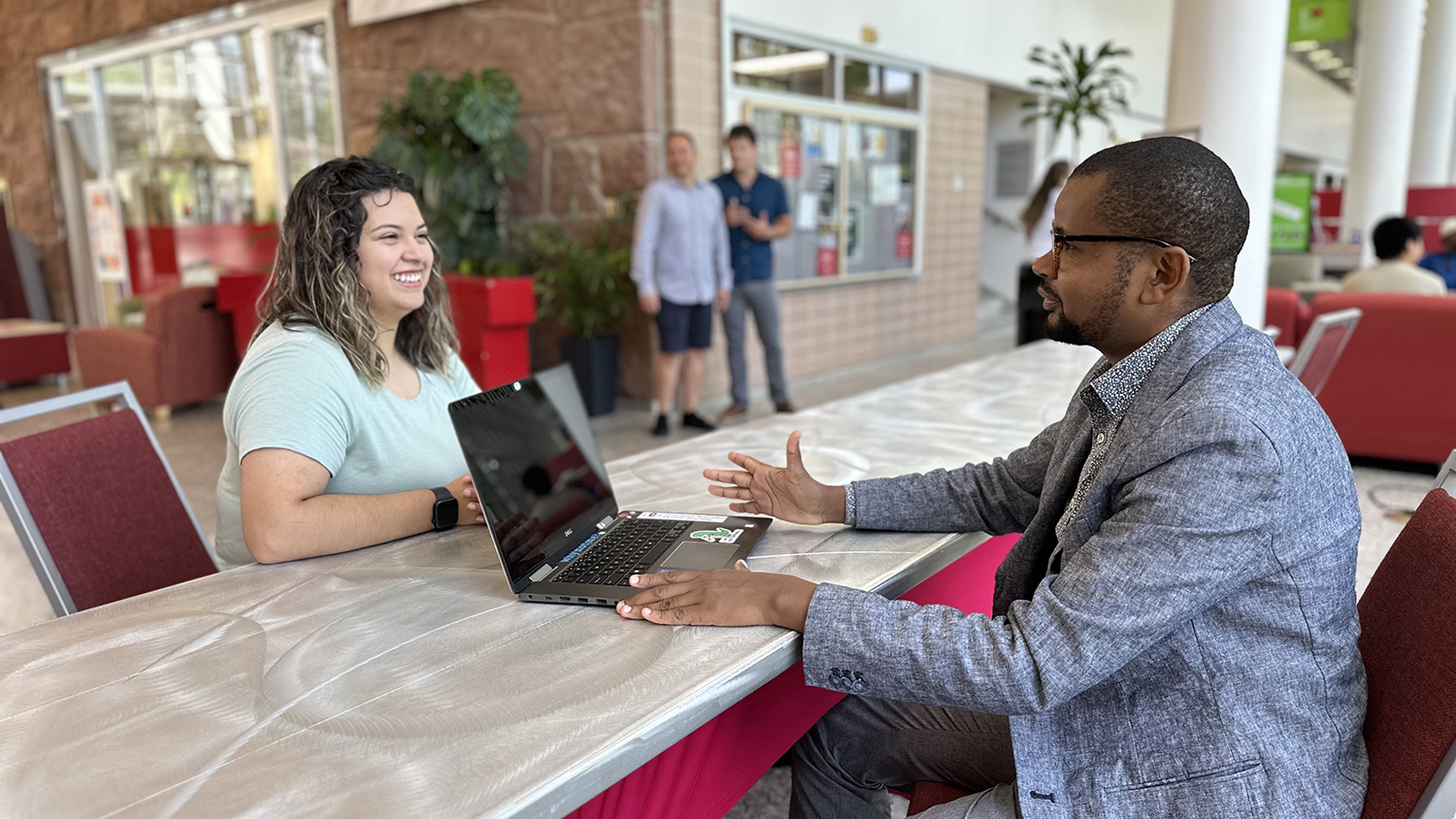 Image of student talking with student success coach