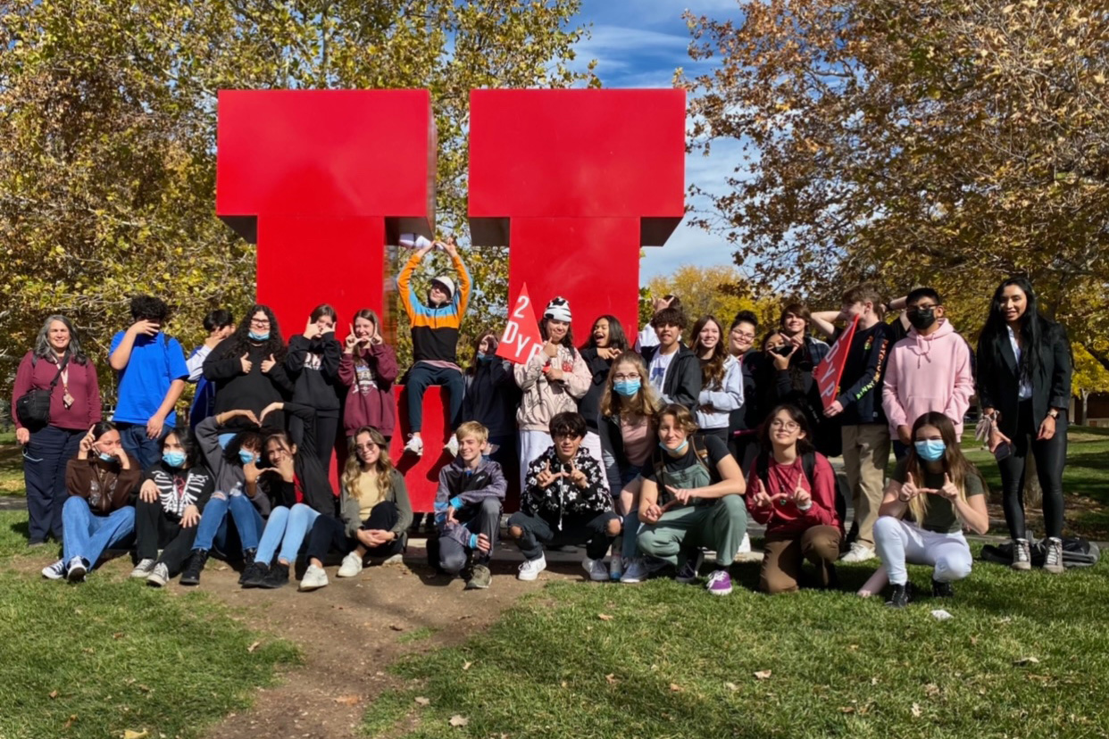 Students in the Defining Your Path program standing next to the block U.